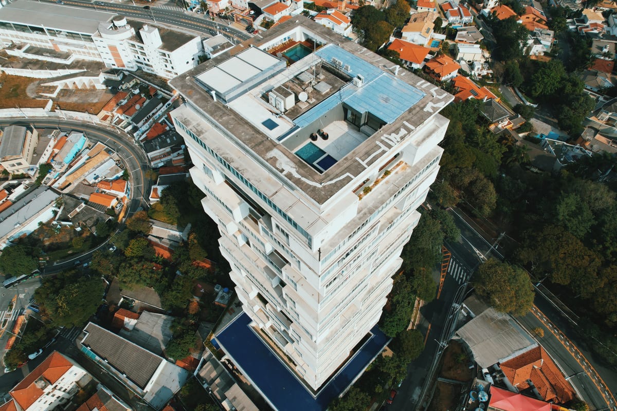 Drone shot capturing a skyscraper in the urban residential area of São Paulo, Brazil.
