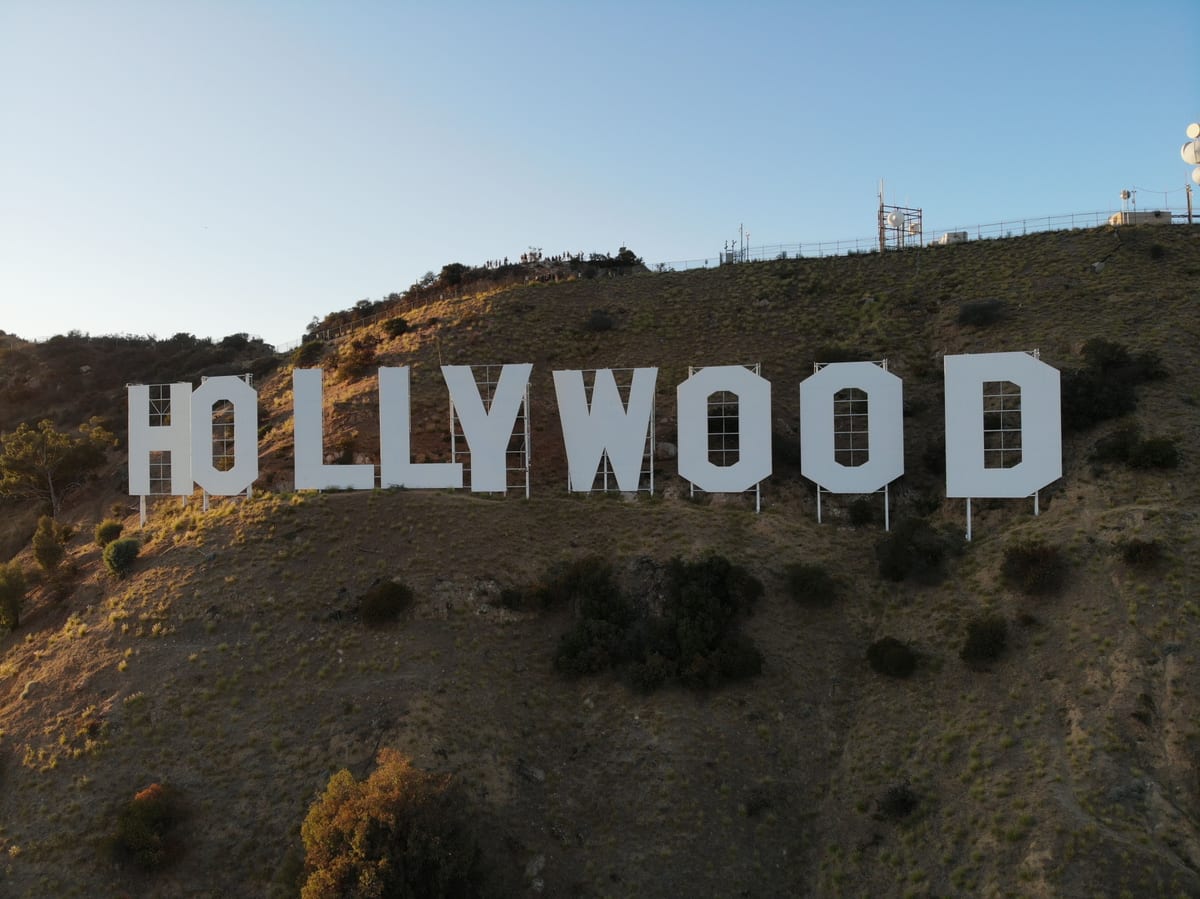 Sunlit view of the iconic Hollywood Sign on Mount Lee in Los Angeles, California.