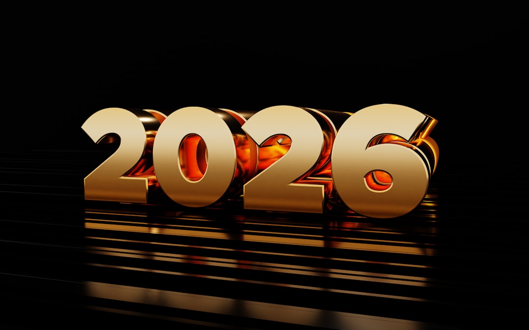 Golden 2026 numbers on a reflective black surface.