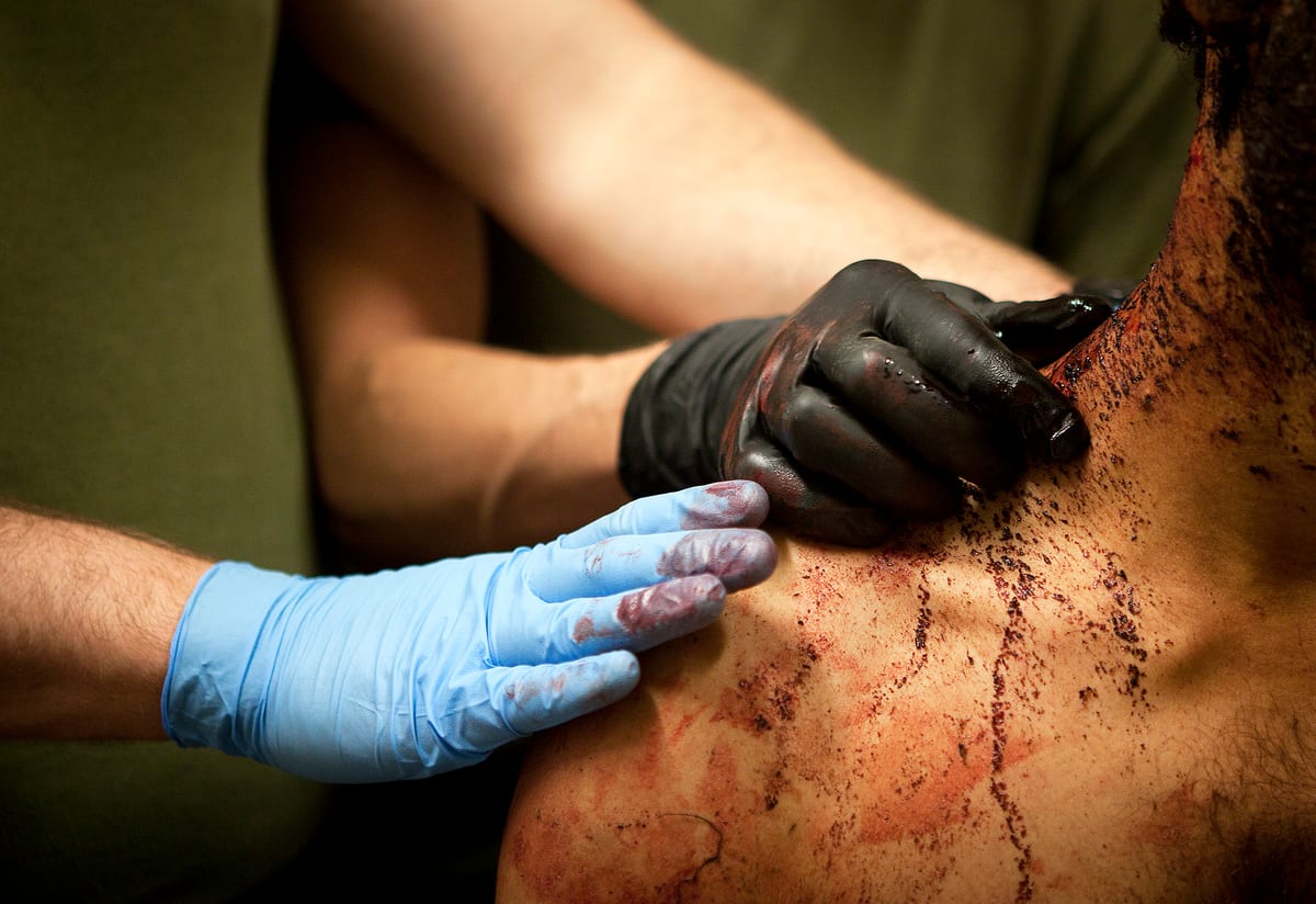 Navy Petty Officer 3rd Class Benjamin Knauth (blue), a 29-year-old native of Centennial, Colo., and Petty Officer 2nd Class Dustin Koch, a 26-year-old native of Las Cruces, N.M., corpsmen with 3rd Bat