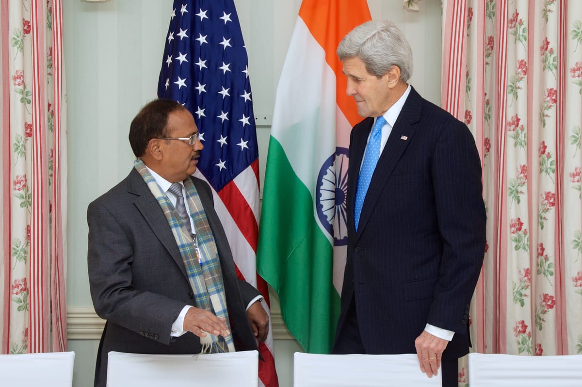 U.S. Secretary of State John Kerry chats with India's National Security Adviser, Ajit Doval, before a bilateral meeting on February 6, 2015, on the sidelines of the Munich Security Conference in Munic