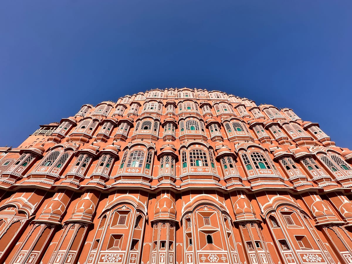 The stunning architecture of Hawa Mahal in Jaipur showcased against a clear blue sky.