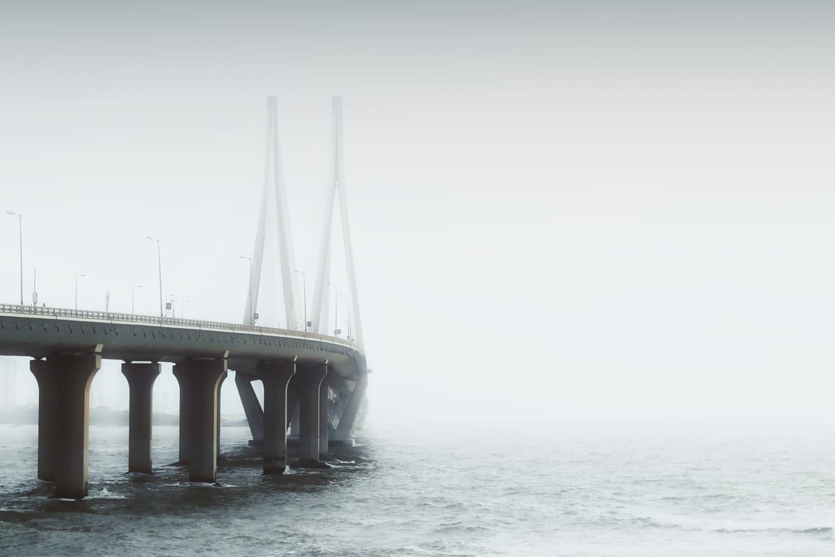 Mystical view of the Bandra-Worli Sea Link shrouded in fog above the Arabian Sea in Mumbai, India.