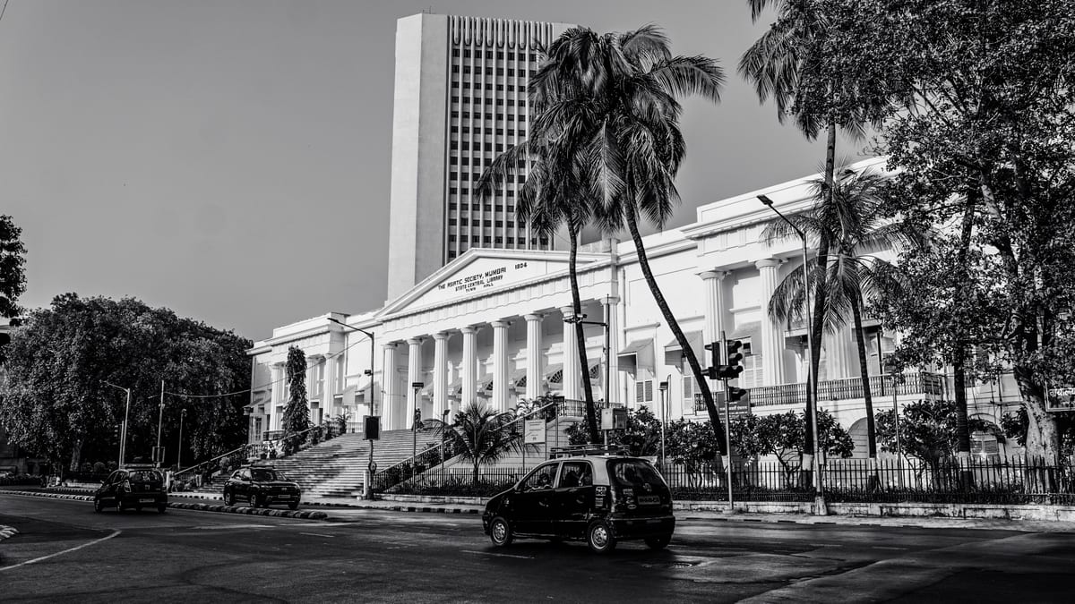 Black and white photo of the Asiatic Society of Mumbai, showcasing its neoclassical architecture.