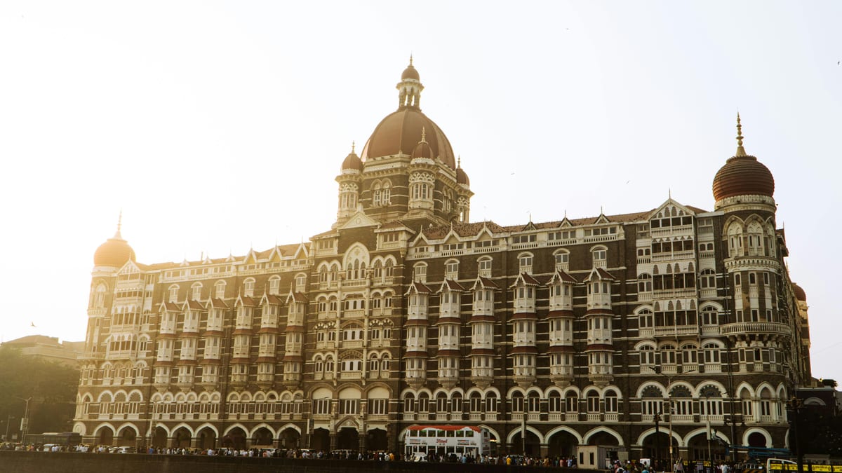 Beautiful view of the iconic Taj Mahal Palace Hotel in Mumbai during a serene sunrise.