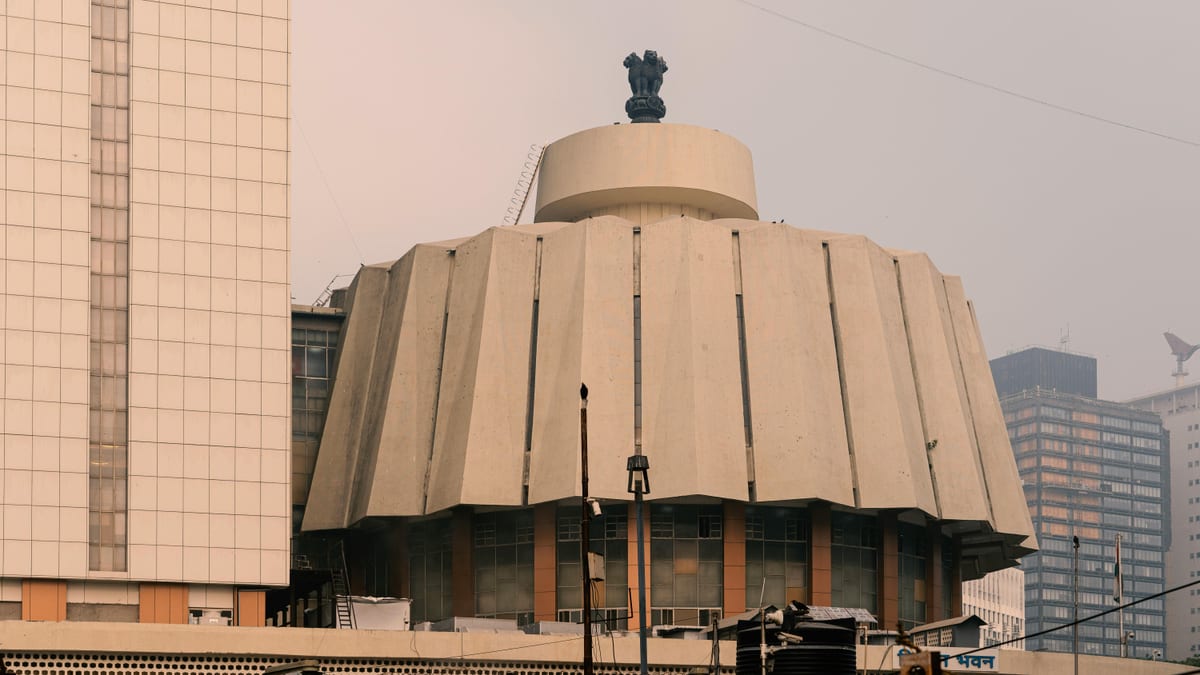 Close-up view of a unique concrete government building with symbolic architecture.