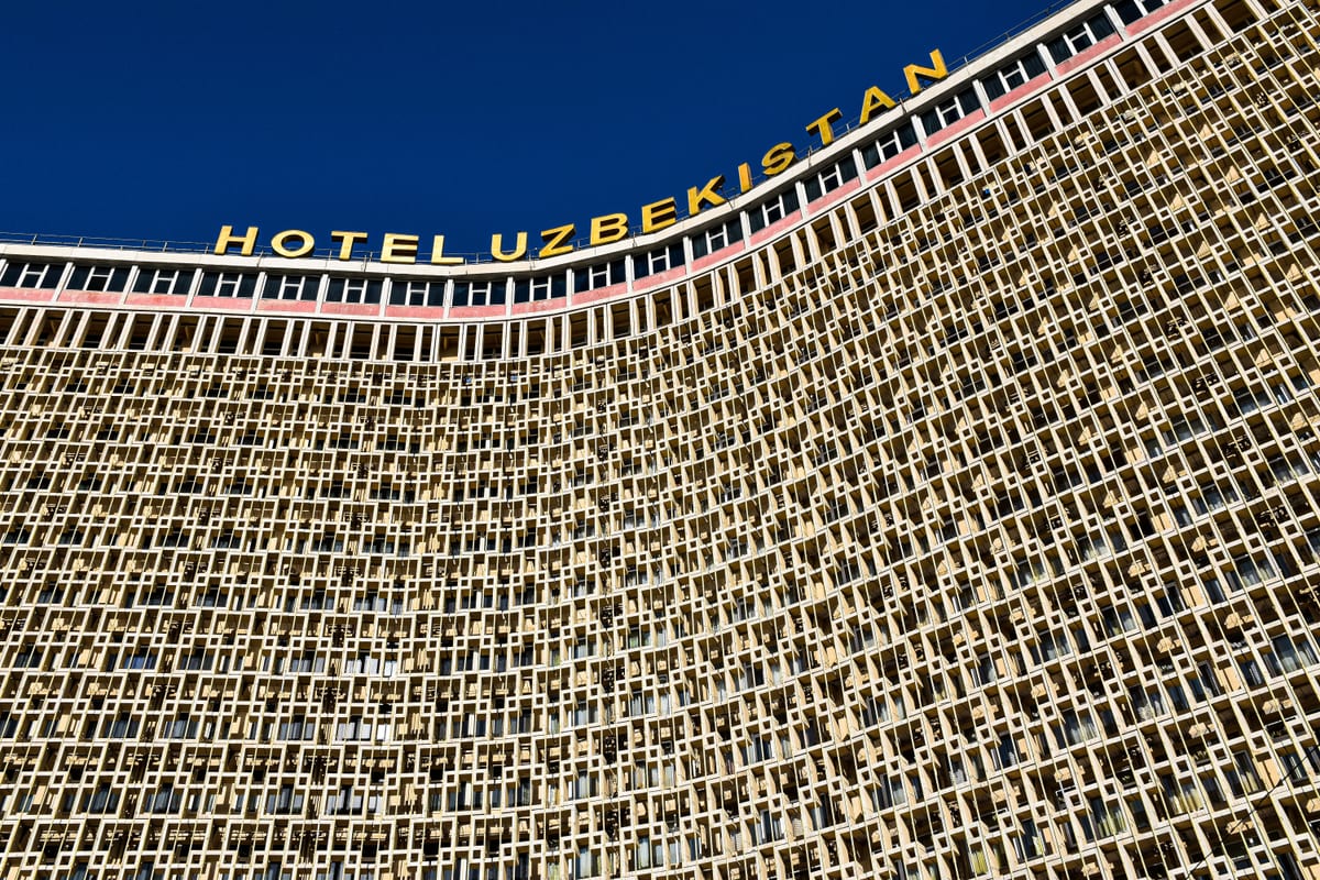 Detailed facade view of the Hotel Uzbekistan landmark in Tashkent, showcasing unique architecture.
