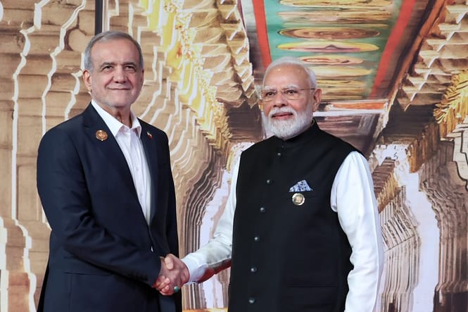 Prime Minister Narendra Modi shakes hands with President Masoud Pezeshkian of Iran at the leaders' welcome, 18th BRICS Summit, New Delhi