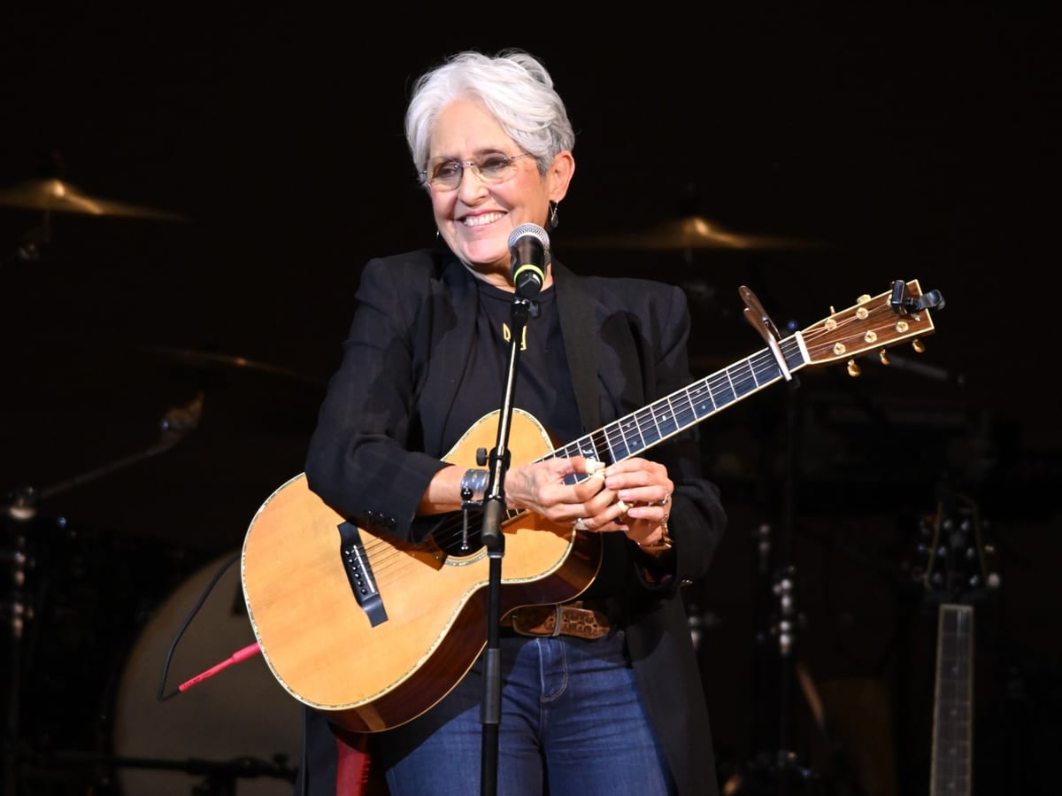 Joan Baez Calls Out Pop Stars: 'Just Take That Little Step'