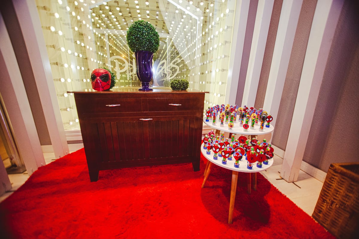 Colorful interior decor featuring a Spiderman mask and vibrant lights, creating a lively atmosphere.