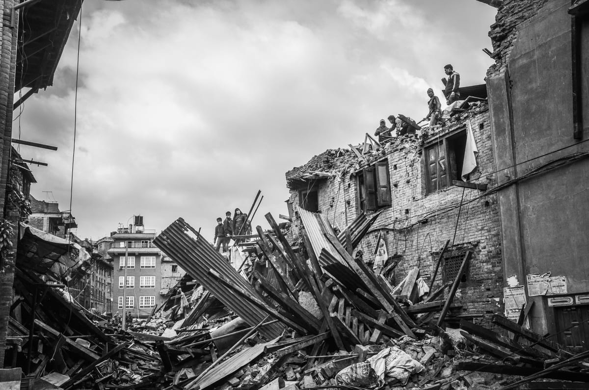 Rubble and ruins from an earthquake in Bhaktapur, Nepal revealing urban devastation.