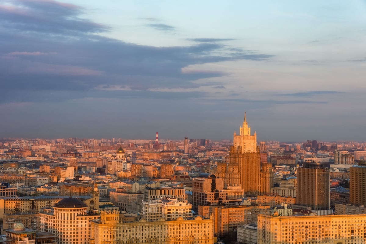 A breathtaking aerial shot showcasing Moscow's skyline with the Ministry of Foreign Affairs building at sunset.