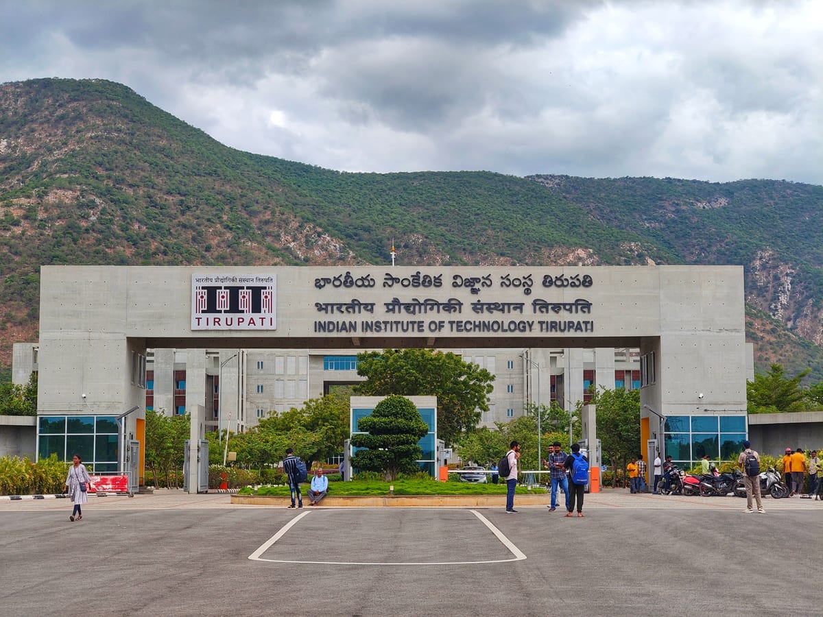 Main entrance of Indian Institute of Technology Tirupati with scenic mountains in background.