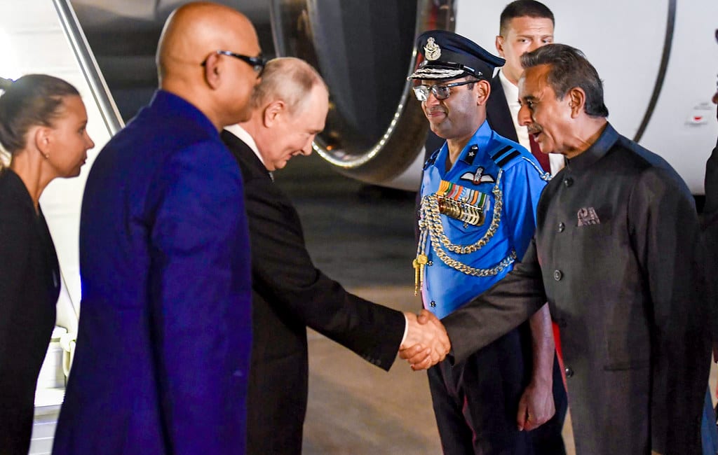 President Vladimir Putin is received on arrival at New Delhi airport for the 18th BRICS Summit