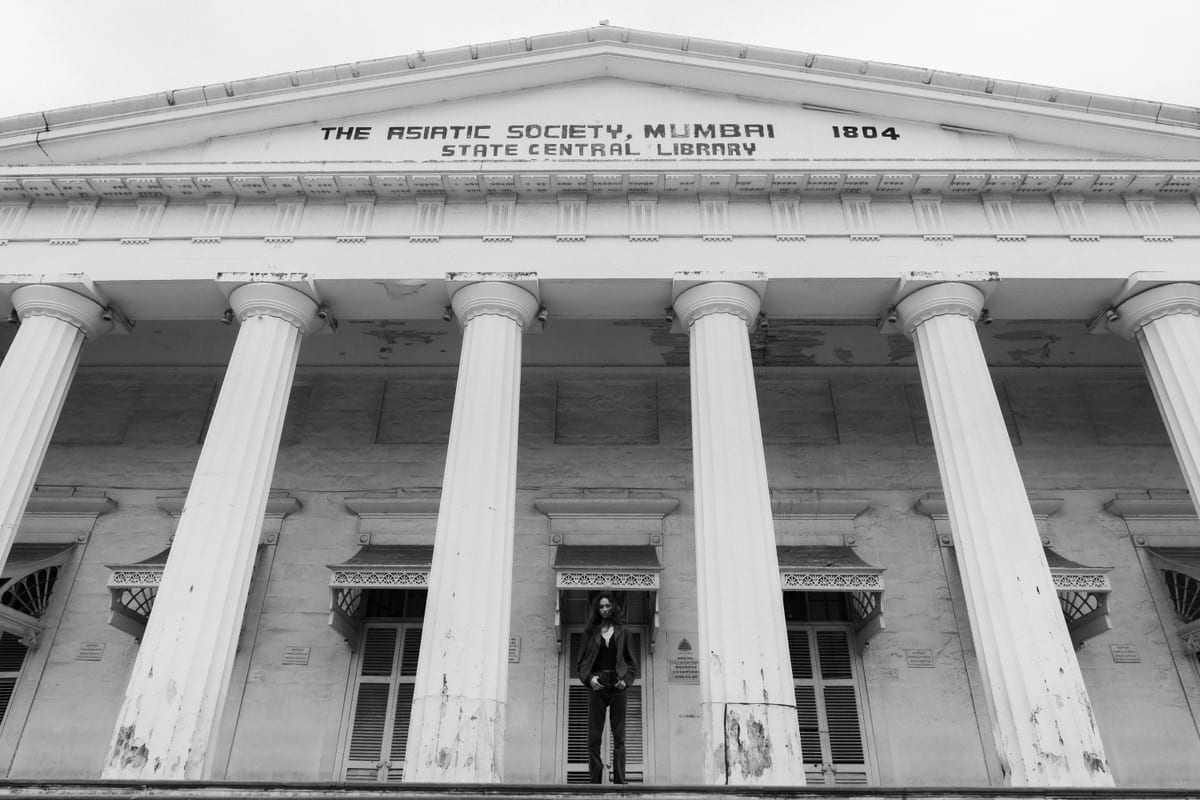 Black and white image of Asiatic Society Mumbai with classical architecture details.