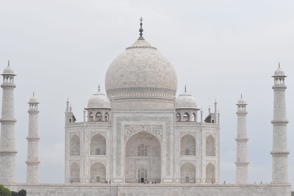 Stunning frontal view of the Taj Mahal's majestic dome and minarets in Agra, India.