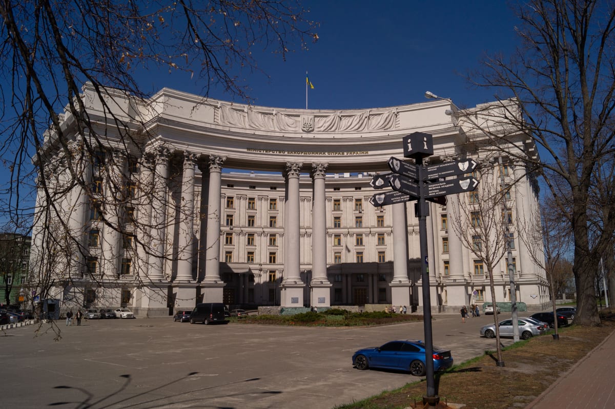 Grand facade of the Ministry of Foreign Affairs in Kyiv, a prime example of architectural elegance under a clear blue sky.