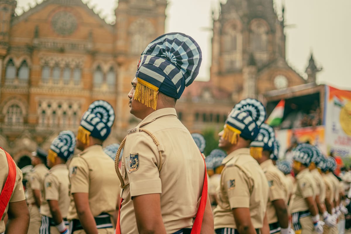 Indian police officers participate in ceremonial parade at Chhatrapati Shivaji Terminus, Mumbai.