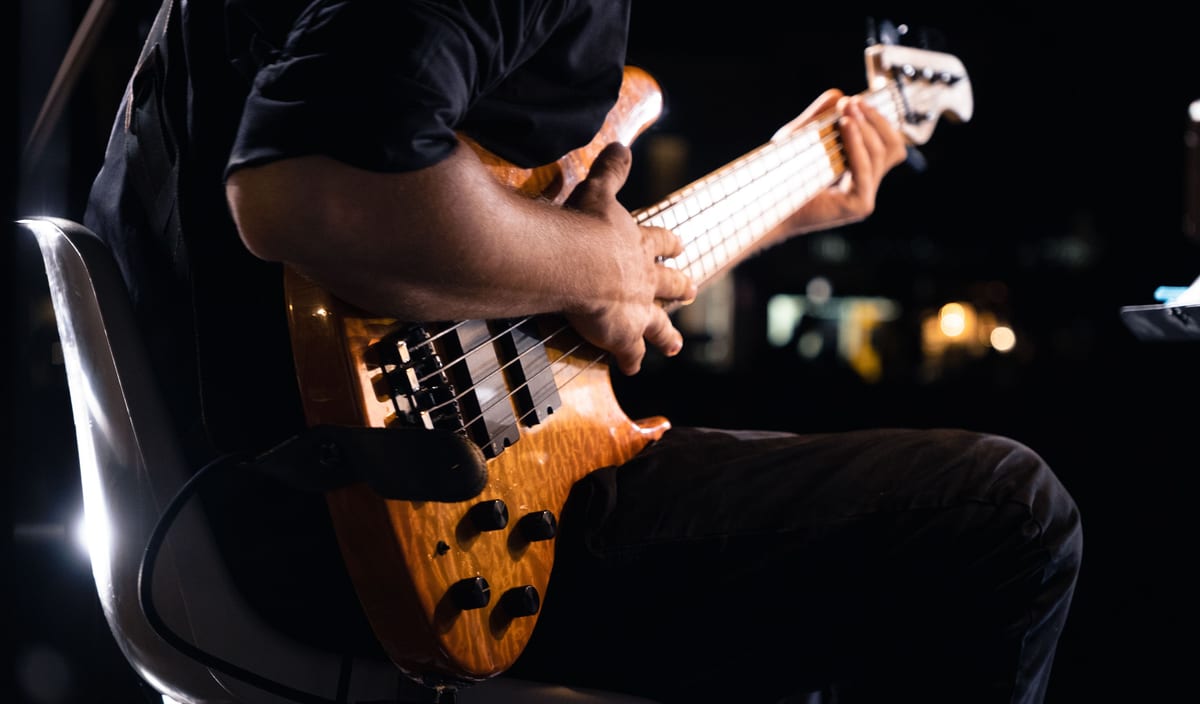Dynamic close-up of a guitarist performing live on stage in Cervia, Italy.